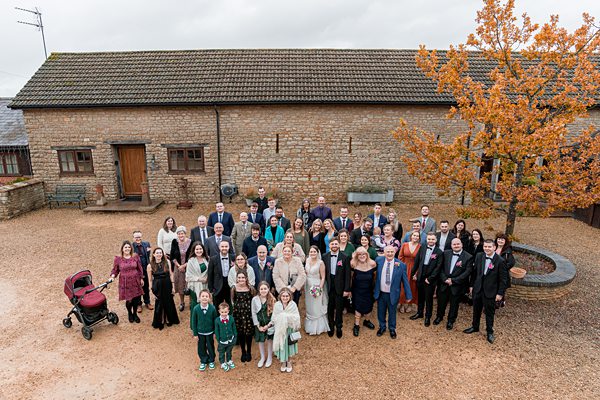 Family and friends gathered at countryside wedding.