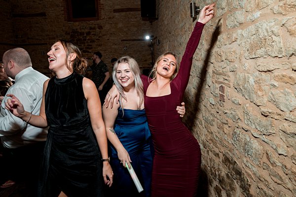 Women dancing joyfully at a party.