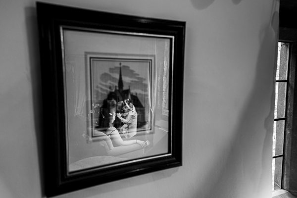 Black and white framed photo on wall.