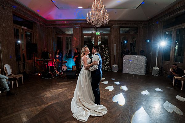 Couple's first dance at elegant wedding reception.