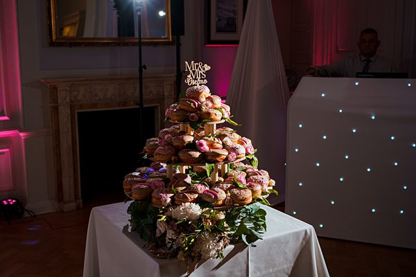 Wedding cupcake tower with "Mr & Mrs" topper.