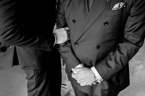 Two men in suits, close-up, black and white photo.