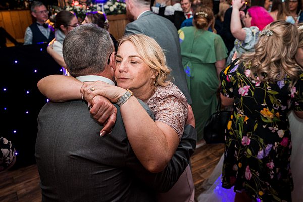 Couple embracing at wedding reception