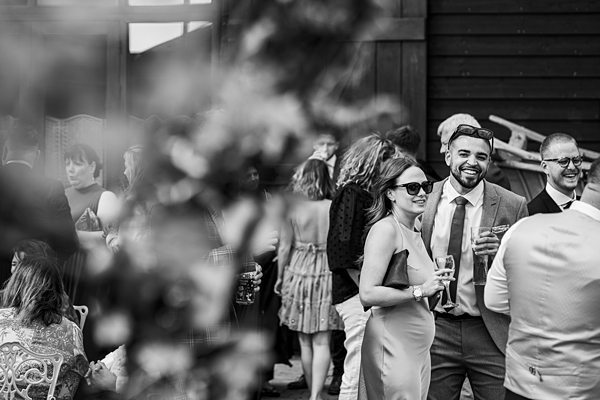 Guests enjoying outdoor event in monochrome.