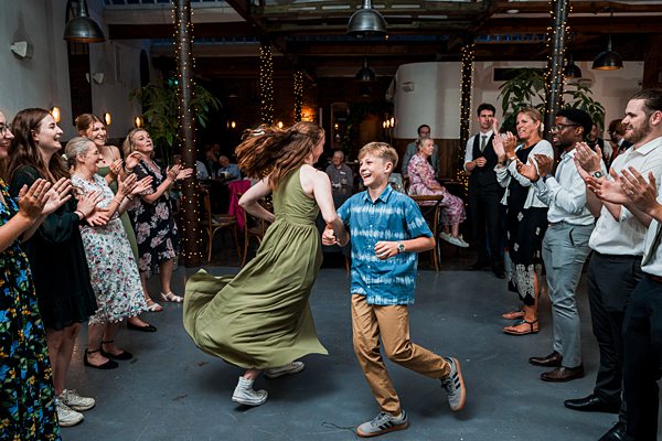 People dancing at a lively party gathering.