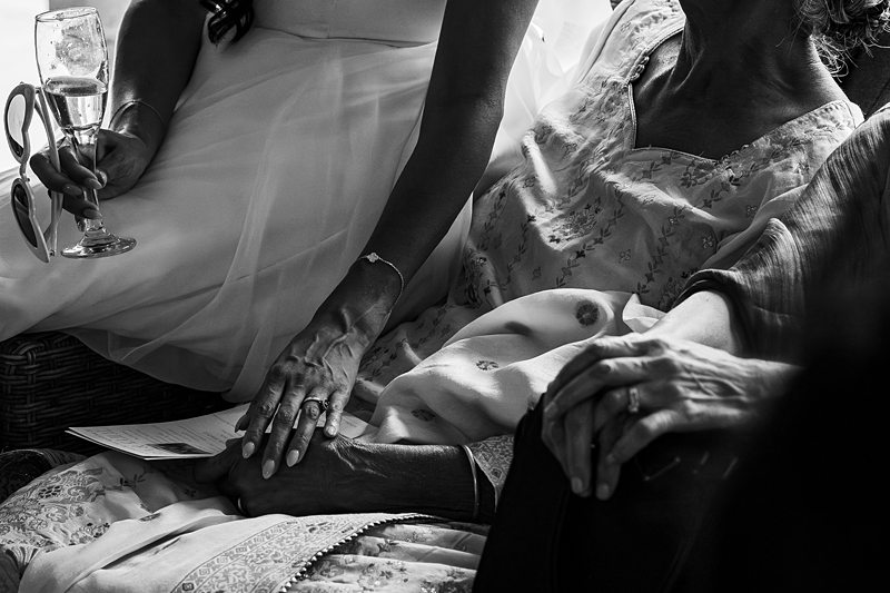 Hands holding gently in a comforting gesture.