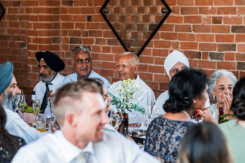 Group of people enjoying a formal social event.