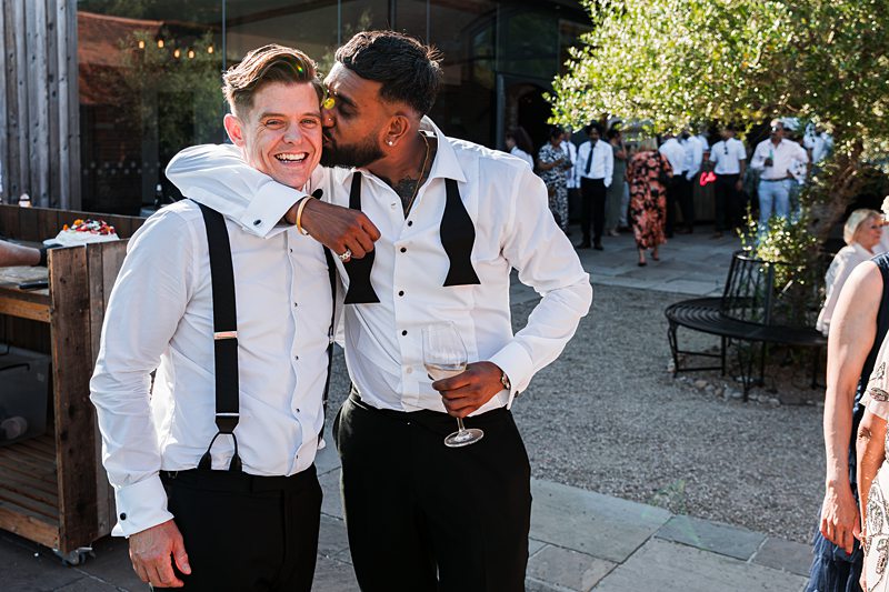 Two friends celebrating at outdoor event.