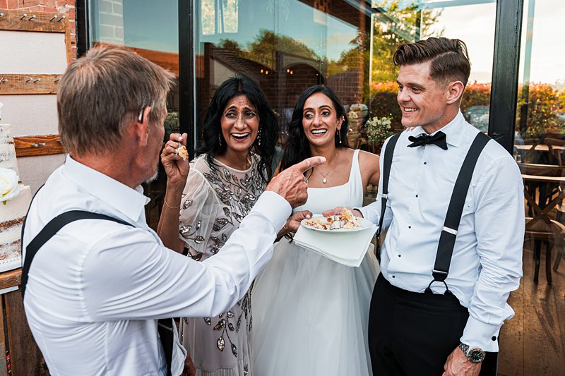 Guests enjoying conversation at a wedding reception.