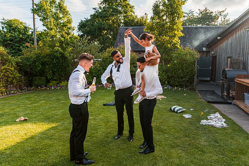 Friends celebrating outdoors, having fun and drinking.