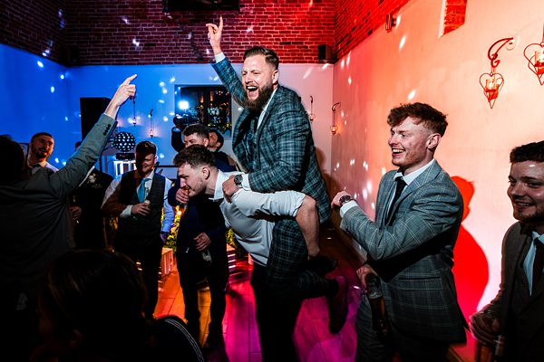 Men celebrating at a lively party